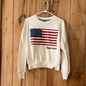 DC Comics Women's Cream Sweater with Superman Flag Design